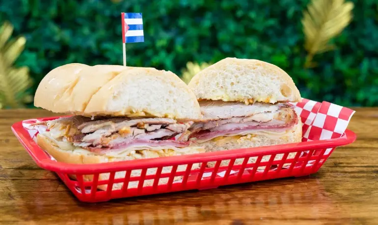 Features their signature Cuban sandwich with the Cuban flag detail